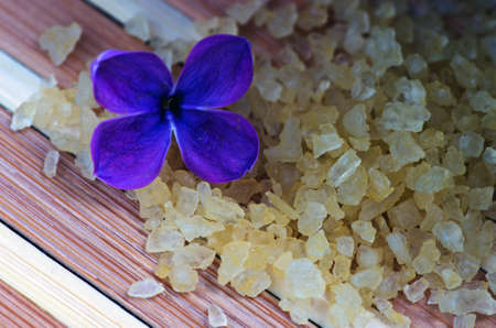 Flowers in a bowl color of brown with sea salt for SPAの写真素材