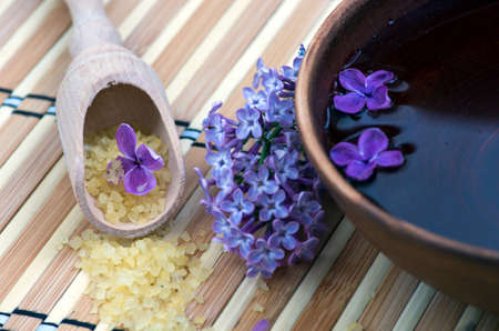 Flowers in a bowl color of brown with sea salt for SPAの写真素材