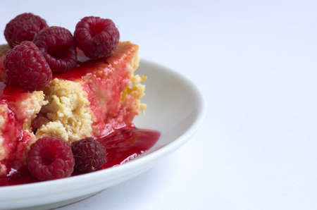 cake with raspberries and cream cheese decorated with fresh raspberries and mint. the toning. selective focusの写真素材