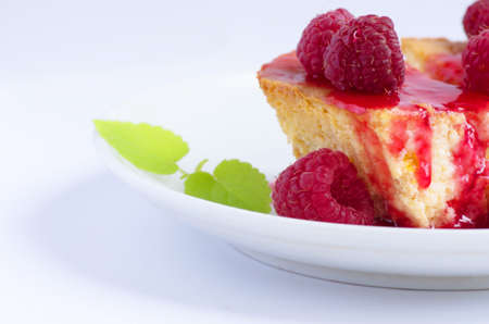 cake with raspberries and cream cheese decorated with fresh raspberries and mint. the toning. selective focusの写真素材