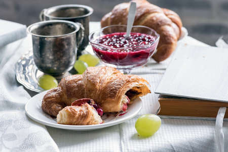 Fresh croissants with coffee cup for a breakfastの写真素材
