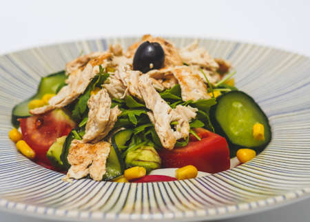 Chicken salad with lettuce, tomato and cucumberの写真素材