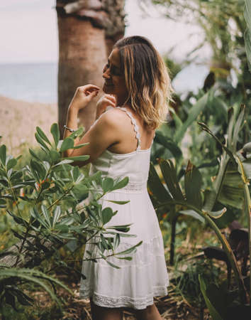 Beautiful and natural woman enjoying nature on a summer day. Vacation and adventure conceptの写真素材