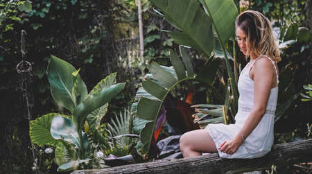Beautiful and natural woman enjoying nature on a summer day. Vacation and adventure concept