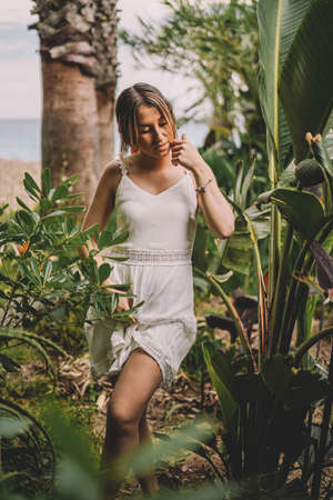 Beautiful and natural woman enjoying nature on a summer day. Vacation and adventure conceptの写真素材