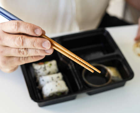 Tray with assorted pieces of sushi. California roll.の写真素材