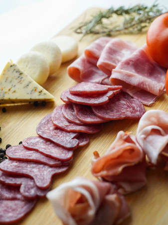 Rustic table of Iberian sausages and cheeses