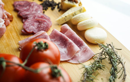 Rustic table of Iberian sausages and cheesesの写真素材