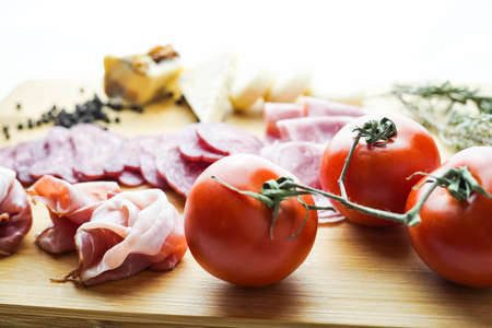 Rustic table of Iberian sausages and cheesesの写真素材