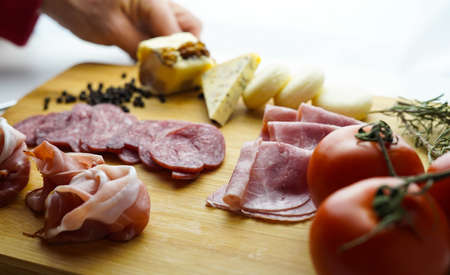 Rustic table of Iberian sausages and cheeses