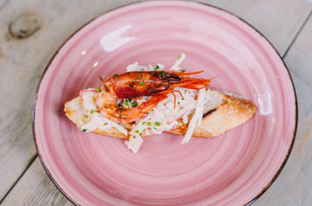 Canape made of bread with crab and vegetablesの写真素材