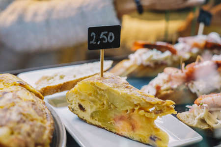 Different assorted canapes of bread with crab, ham and vegetables