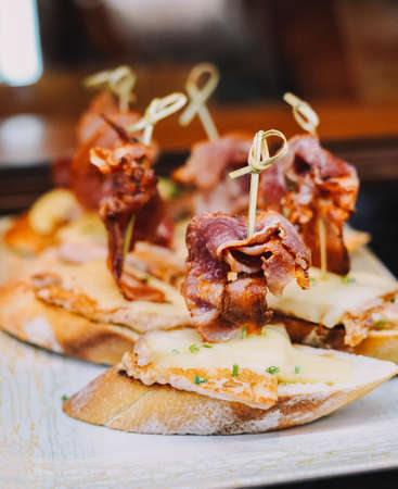 Different types of canapes with Iberian ham, croquettes and cheese