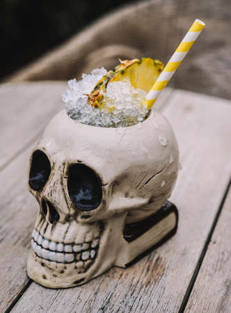 Tropical cocktail served in a skull-shaped glassの写真素材
