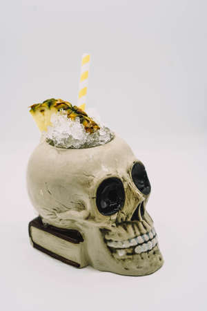 Tropical cocktail served in a skull-shaped glass