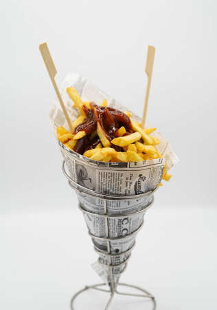 fries cone with ketchup ready to goの写真素材