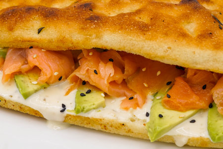Ciabatta bread sandwich with smoked salmon and vegetables