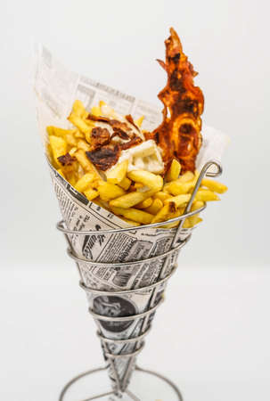 fries cone with ketchup and bacon ready to goの写真素材