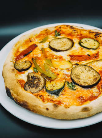 A typical Neapolitan pizza with vegetables and mozzarella, made with sourdoughの写真素材