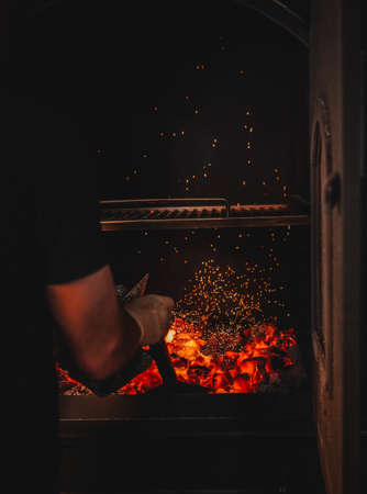 Image of burning coals in a restaurant grillの写真素材