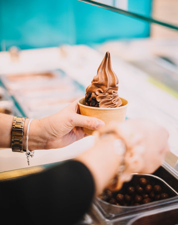 Chocolate yogurt ice cream with syrupの写真素材