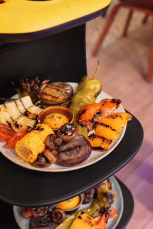 Assorted grilled vegetables carried by a robot waiter