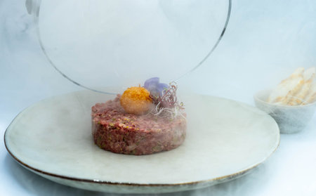 An impressive high-quality smoked beef tartareの写真素材