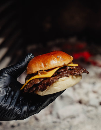 <p>Smashed Cheeseburger on a wooden table in front of a fireplace.</p>の写真素材