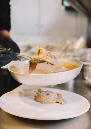 In this photo, we see a plate of homemade Italian pasta with a delicious sauce. The pasta is...