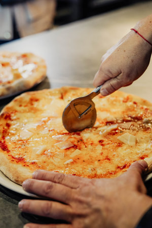 Homemade Italian-style pizza. Freshly kneaded dough, hand crushed tomatoes, and a perfect blend of mozzarella and Parmesan cheese make this pizza a true work of artの写真素材