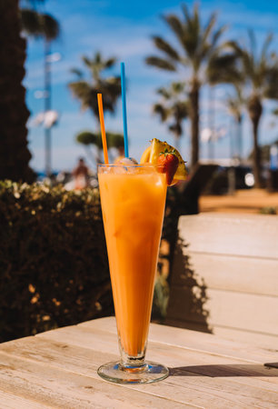 A Tequila Sunrise is a colorful and fruity cocktail that is typically made with tequila, orange juice, and grenadine syrup.の写真素材