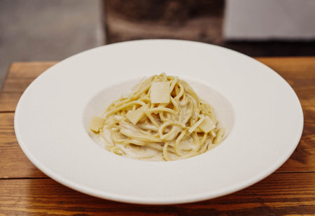 A plate of fresh homemade Italian pasta with typical Mediterranean saucesの写真素材