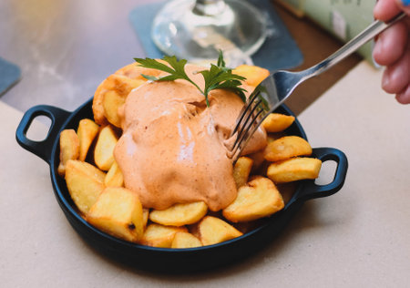 Portion of patatas bravas with spicy sauceの写真素材