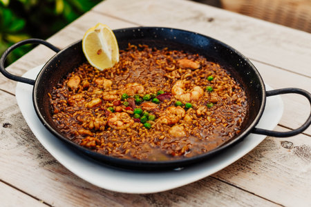 A typical Valencian seafood paella with riceの写真素材