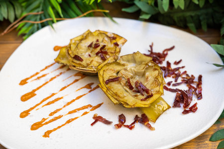 Baked artichokes with Iberian hamの写真素材