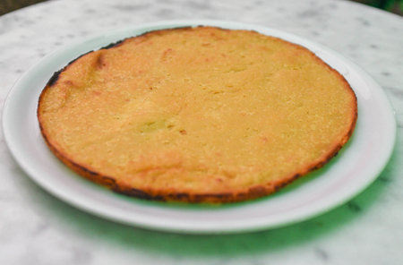 Faina, dish made from chickpea flour, which is similar to a savory, thick pancake or flatbread