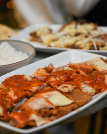 Snack dinner with pizzas and Argentine Milanese.の写真素材