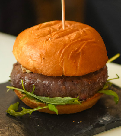 150 gram gourmet burger of premium beef with brioche bread and arugula