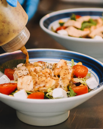 Salad with chicken, cherry tomatoes, Greek cheese and arugulaの写真素材