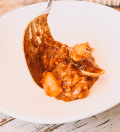 Brothy rice with seafood. A restaurant dish.