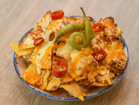 Nachos with cheese, jalapeno and chili pepperの写真素材
