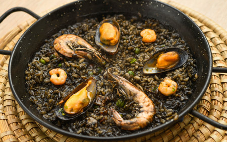 Paella with mussels and shrimps in a panの写真素材
