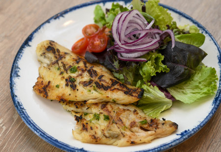 Grilled Fish Fillet with Fresh Garden Salad and Cherry Tomatoes