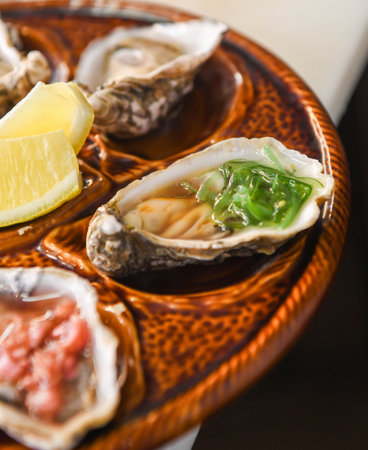 Six oysters with various toppings served on a brown ceramic plate