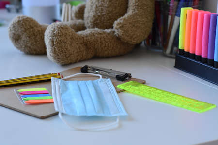 Schools supplies on white background in pandemic time