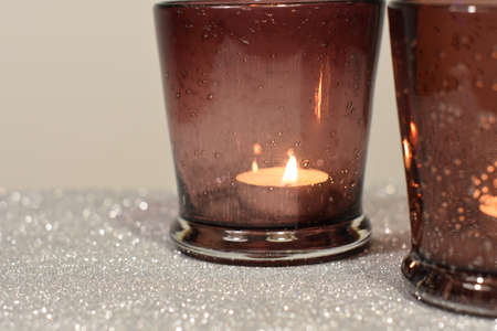 Christmas candles on silver backgroundの写真素材