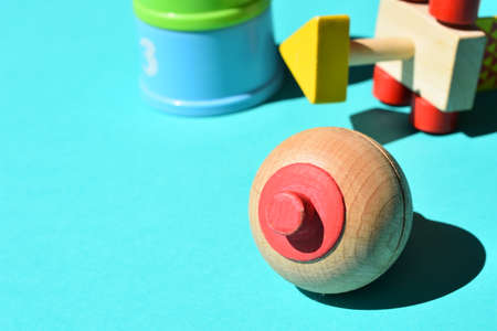 wooden top on blue background with writing spaceの写真素材