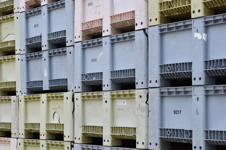 Plastic containers lined up in the portの写真素材