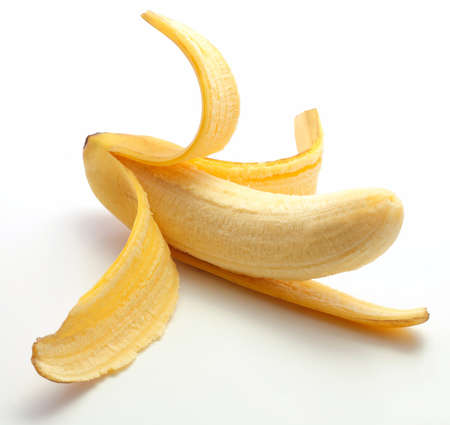 half peeled fresh banana isolated on the white backgroundの写真素材