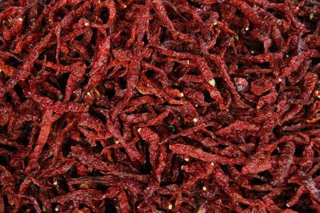 Lot of edible dried chili peppers on the marketの写真素材